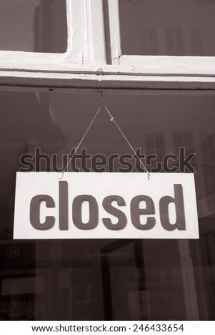 Closed Sign on Shop Window in Black and White Sepia Tone