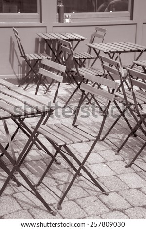 Cafe Table and Chairs on Outdoor Terrace in Black and White Sepia Tone