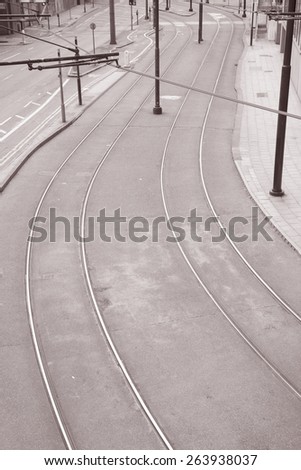Urban Scene with Tram Lines on Street in Black and White Sepia Tone