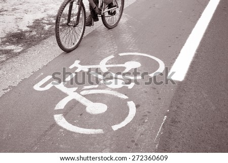 Cycle Lane and Cyclist, Formentera, Balearic Islands, Spain in Black and White Sepia Tone