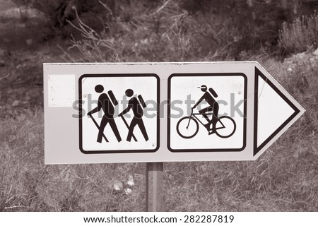 Bike and Walking Tour Sign in Black and White Sepia Tone