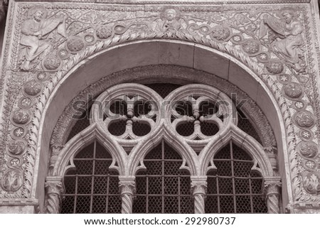 Detail of Sculpture on Facade St Marks Cathedral, Venice, Italy in Black and White Sepia Tone