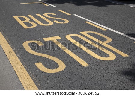 Bus Stop Sign Painted on Road