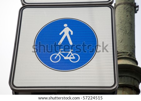 Pedestrian and bicycle sign in urban setting