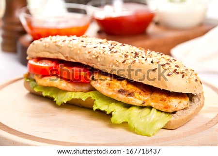 Grilled chicken breast  sandwich with vegetables