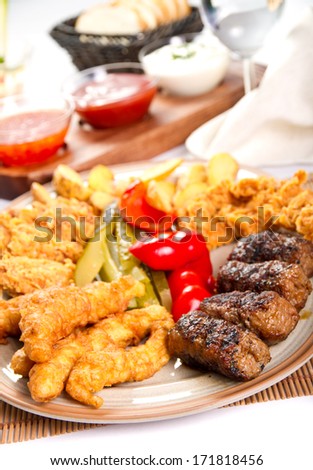 Mixed grilled and fried  meat platter and pickles