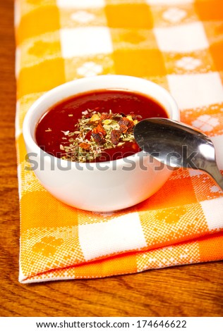 Hot sauce with dried chilli and basil
