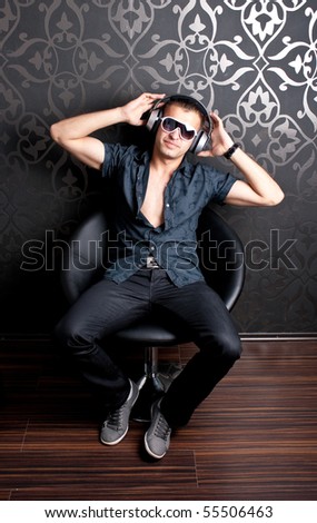 Cool guy sitting on an armchair