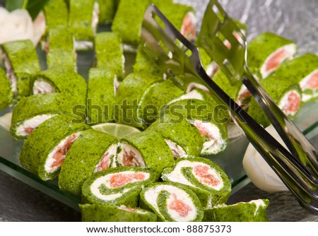 Creative sushi rolls on a plate (focus in the lower third)