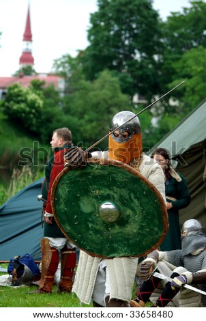 PARNU, ESTONIA - JUNE 28: Participants in medieval clothes get ready to participate during 29th International Hanseatic Days 26-28th of June 2009 in Parnu,Estonia.