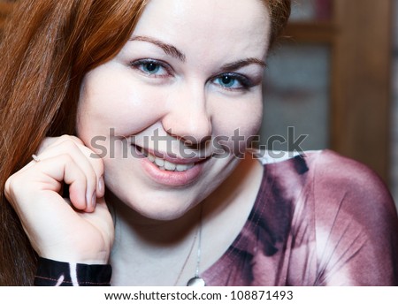 Beautiful young woman portrait with closeup smiling face