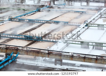 Snow-covered aeration wastewater tanks in sewerage treatment plant