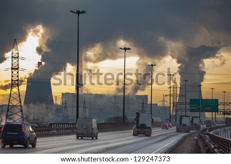 SAINT-PETERSBURG, RUSSIA-DECEMBER 23: City ringway and air pollution from heat electric generator plant on December 23, 2012 in Saint-Petersburg, Russia.  Strong vapor and smoke due extreme cold