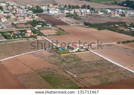 View above of Cypriot settlements near big city in Cyprus island. Houses roofs