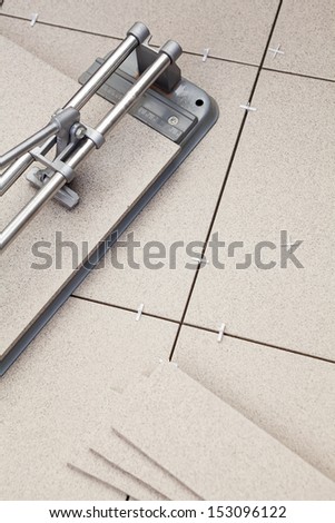 Cutting tiles for floor laying