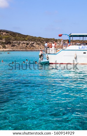 LATCHI, CYPRUS - CIRCA SEPTEMBER, 2013: Recreational marine boats are in the Blue Lagoon on circa September, 2013 in Latchi, Cyprus. It is tourists famous place in Latchi village, Mediterranean Sea