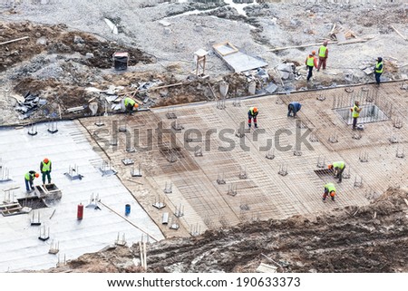 Construction of primary foundation, people at work