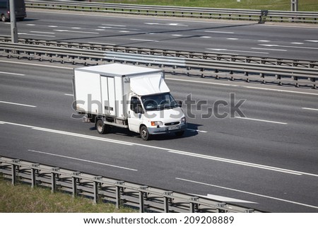 SAINT-PETERSBURG, RUSSIA - CIRCA JULY, 2014: Small truck drives on the Saint-Petersburg city highway without container. The federal public road A-118