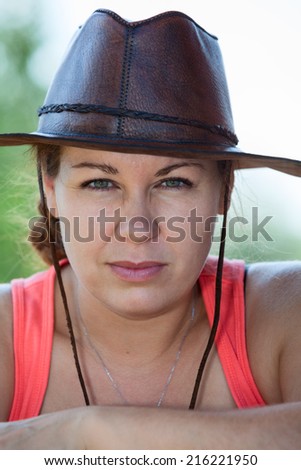 Cowboy country woman in hat, facial portrait