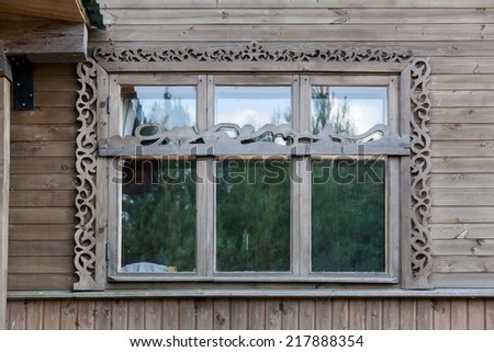 Front view of large wide wooden window in house