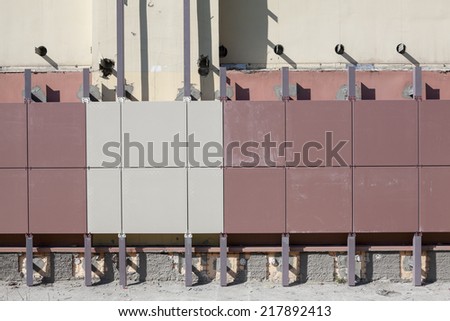 Installation of ventilated facades with tiles of building wall