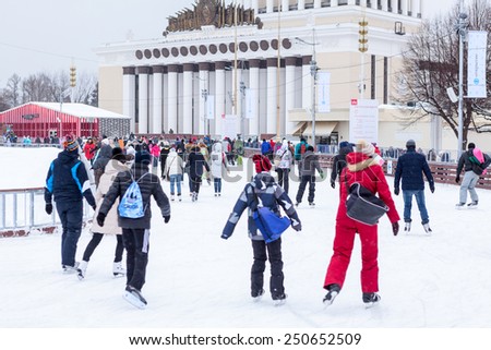 MOSCOW, RUSSIA - CIRCA JAN, 2015: People are on main city skating rink in Moscow VDNKh area. VDNKh is the all-Russian Exhibition Center with huge skating ring at winter season