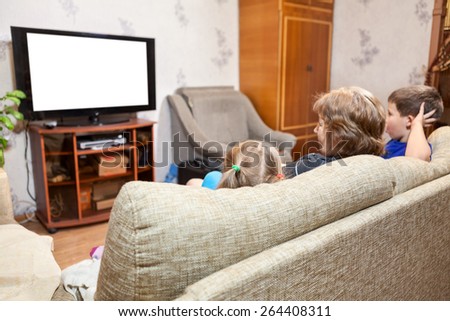 Family at home, watching lcd tv sitting on sofa, three people. Isolated white screen