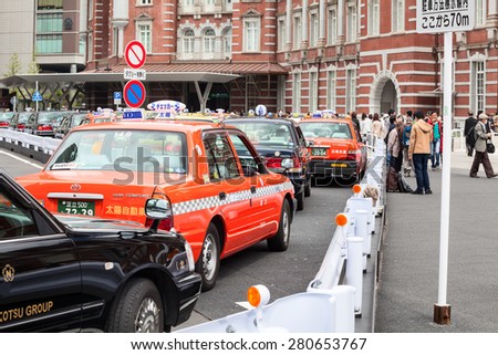 TOKYO, JAPAN - CIRCA APR, 2013: Color taxicabs wait passengers on the parking area near the Tokyo subway station. Public transport is in center of the city