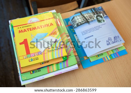 ST. PETERSBURG, RUSSIA - CIRCA SEPTEMBER, 2014: School exercise and ABC books lay on the desk in classroom. Children go back to school at first time in September