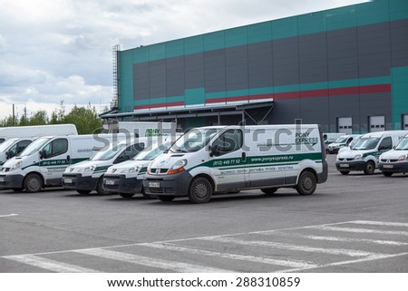 ST. PETERSBURG, RUSSIA - CIRCA JUN, 2015: Vehicles are on parking lot of Pony Express near warehouse terminal. The Pony Express is a worldwide mail service