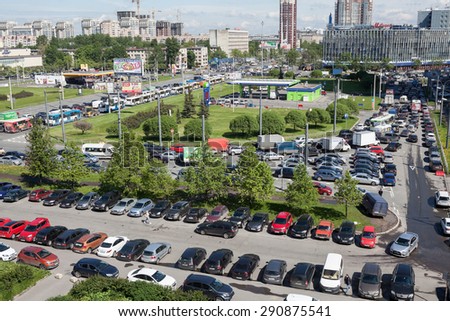 SAINT-PETERSBURG, RUSSIA - CIRCA MAY, 2015: Traffic jam is on city streets due road repair. Roads crossing at Constitution square, aerial view. Rush hour
