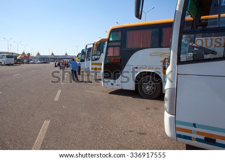 HURGHADA, EGYPT - CIRCA NOV, 2015: Line from the passenger buses for people local transfer to hotels resorts is in the Hurghada International airport