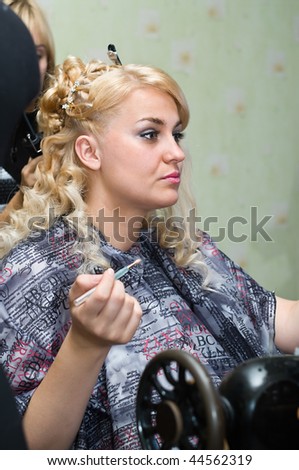 Beauty bride the blond. Bride prepares to the wedding ceremony in room. Portrait. Caucasian