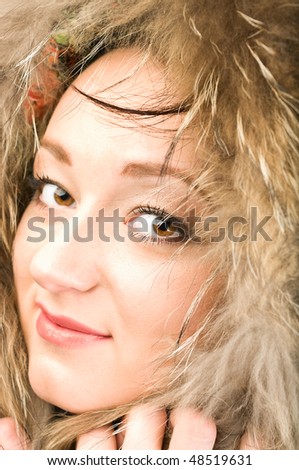 Beautiful woman. Winter fashion & makeup. Face in fur hood.