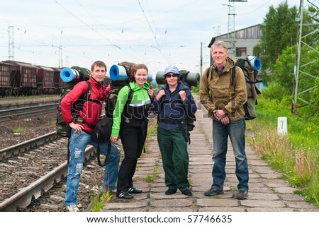 Group of travelers on railway station waiting a train. Mountaineering