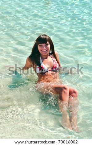 Beautiful sexy young woman in sea water
