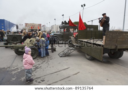 SAINT-PETERSBURG, RUSSIA – NOVEMBER 4: Military performance in celebration of National Unity Day. Soviet soldier singing from the lorry on November 4, 2011 in Saint-Petersburg, Russia.