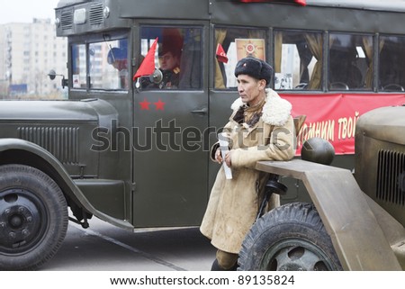 SAINT-PETERSBURG, RUSSIA – NOVEMBER 4: Military performance in celebration of National Unity Day. Soviet soldier standing near lorry on November 4, 2011 in Saint-Petersburg, Russia.