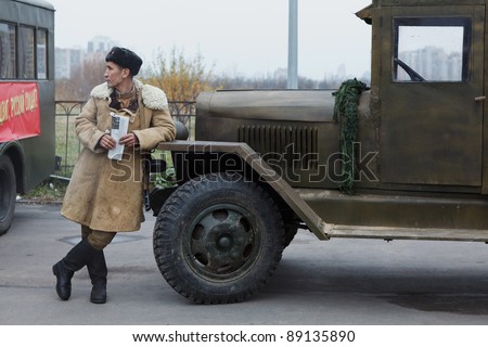 SAINT-PETERSBURG, RUSSIA – NOVEMBER 4: Military performance in celebration of National Unity Day. Soviet soldier standing near lorry on November 4, 2011 in Saint-Petersburg, Russia.