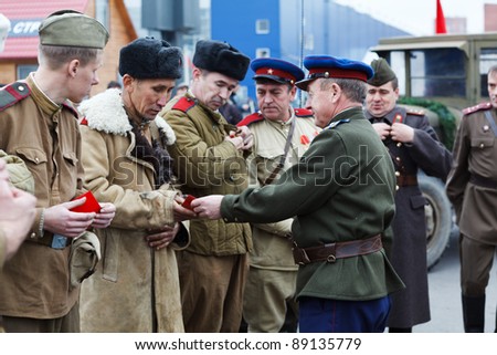 SAINT-PETERSBURG, RUSSIA – NOVEMBER 4: Military performance in celebration of National Unity Day. Soviet soldiers awarded the medals on November 4, 2011 in Saint-Petersburg, Russia.
