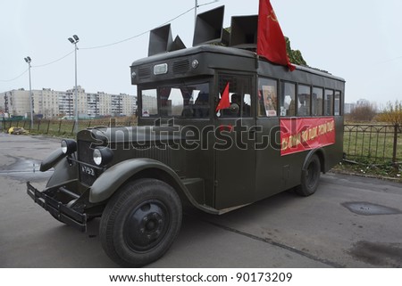 SAINT-PETERSBURG, RUSSIA – NOVEMBER 4: Military performance in celebration of National Unity Day. Soviet bus GAS-03-30 with red flags on November 4, 2011 in Saint-Petersburg, Russia.