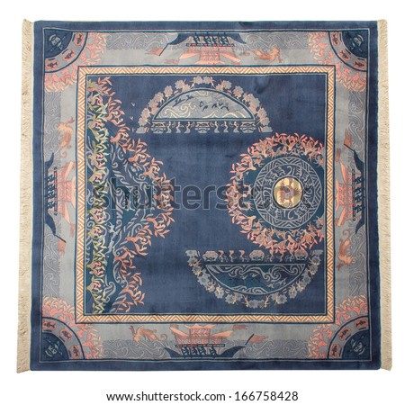 The Chinese woolen carpet of handwork on a white background with ethnic motives