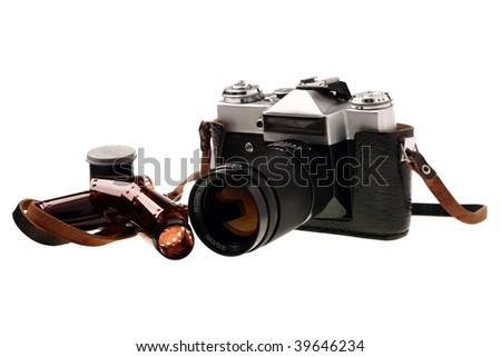 Old 35mm camera with a telephoto lens on a white background