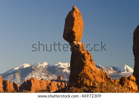 Balancing rock with Manti La Sal mountains in the background, Arches Nat. Park, Utah