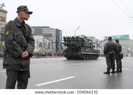 MOSCOW-MAY 9: Soldiers look at the Self-propelled fire installation Buk-M2 2 at the Victory Day Parade on May 9, 2012 in Moscow