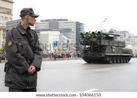 MOSCOW-MAY 9: Soldiers look at the Self-propelled fire installation Buk-M2 2 at the Victory Day Parade on May 9, 2012 in Moscow