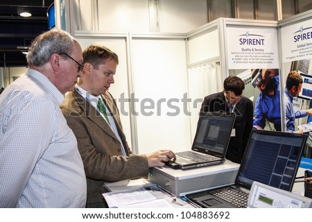 MOSCOW-June 1: Man shows the operation navigation system at the international exhibition of navigation equipment and software Navitech on June 1, 2011 in Moscow
