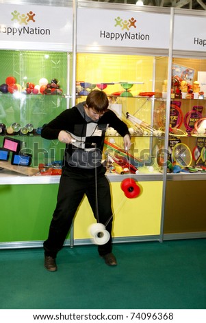 MOSCOW - MARCH 16: The guy play the yo-yo presented at the International Toy Specialized Exhibition March 16, 2011 in Moscow