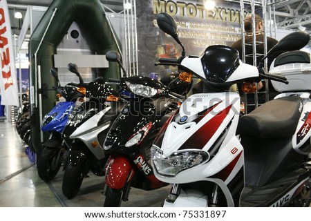 MOSCOW - APRIL 1: Omaks Motors Electric scooters motorbikes at the Moscow specialized Exhibition  of motor cycling industry in Russia on April 1, 2011 in Moscow, Russia
