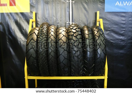 MOSCOW - APRIL 1: Stacks of new motorcycle racing tires at the Moscow specialized Exhibition  of motor cycling industry in Russia on April 1, 2011 in Moscow, Russia
